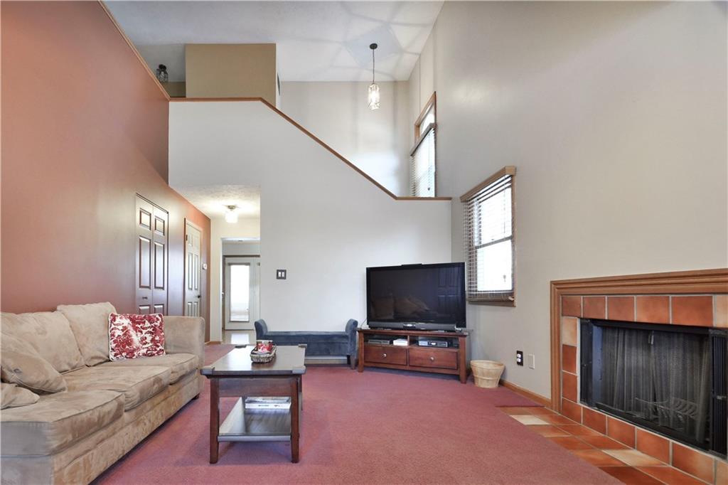 808 Brighton Woods Road Pittsburgh, PA 15212 - Photo 3 of 24 ...and you're greeted by this amazing living and entertaining space with its log burning fireplace, vaulted ceiling and open and airy staircase, flooded with natural light!