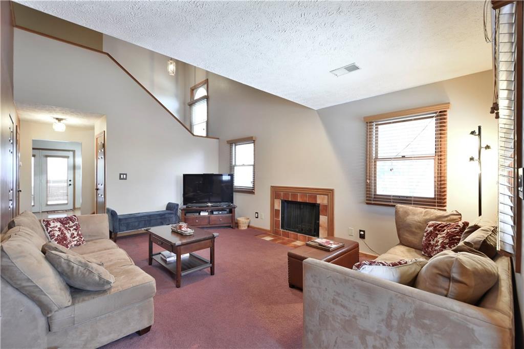 808 Brighton Woods Road Pittsburgh, PA 15212 - Photo 4 of 24 The living room has direct access to the kitchen/dining areas and right out to the rear yard through the door you see on the left.
