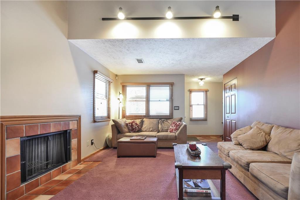 808 Brighton Woods Road Pittsburgh, PA 15212 - Photo 5 of 24 The vaulted living space is highlighted by rheostat controlled track lighting, helping you set the mood as you wish. One of two closets is shown close to the entry while the second is just right of the sofa.