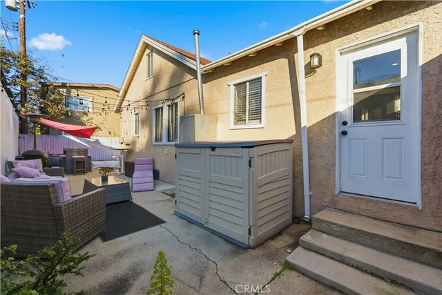 a patio with table and chairs