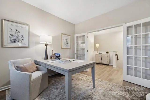 a bathroom with a double vanity sink a mirror and a bathtub