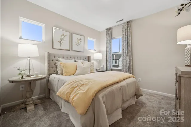 a bed room with a bed and a chair