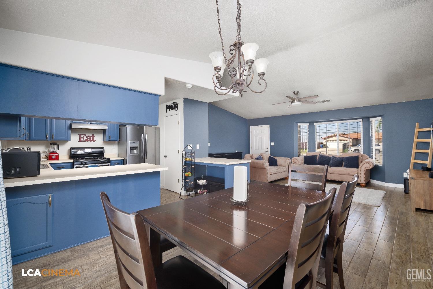 Undisclosed Address McFarland, CA 93250 - Photo 11 of 24 a view of a dining room with furniture a rug and wooden floor