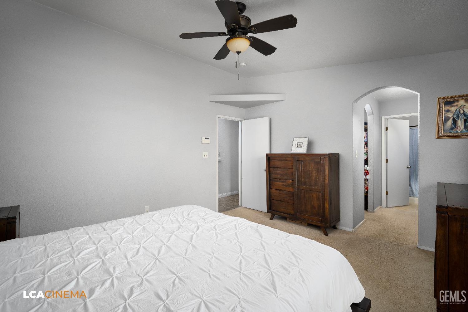 Undisclosed Address McFarland, CA 93250 - Photo 15 of 24 a bedroom with a bed and a chandelier