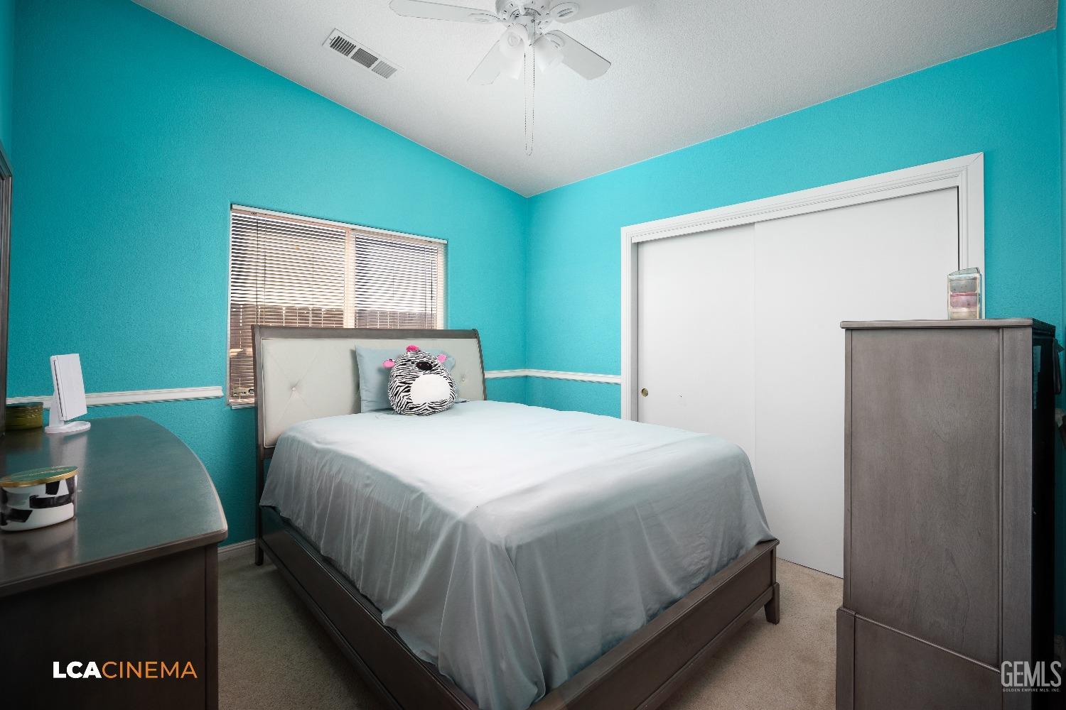 Undisclosed Address McFarland, CA 93250 - Photo 17 of 24 a bedroom with a bed and a desk