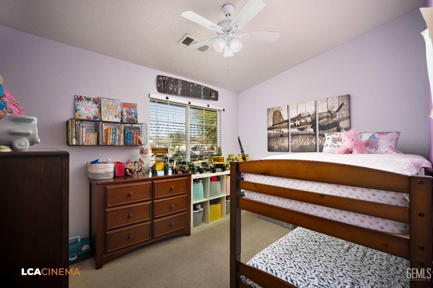 Undisclosed Address McFarland, CA 93250 - Photo 20 of 24 a bedroom with a bed dresser and a baby crib
