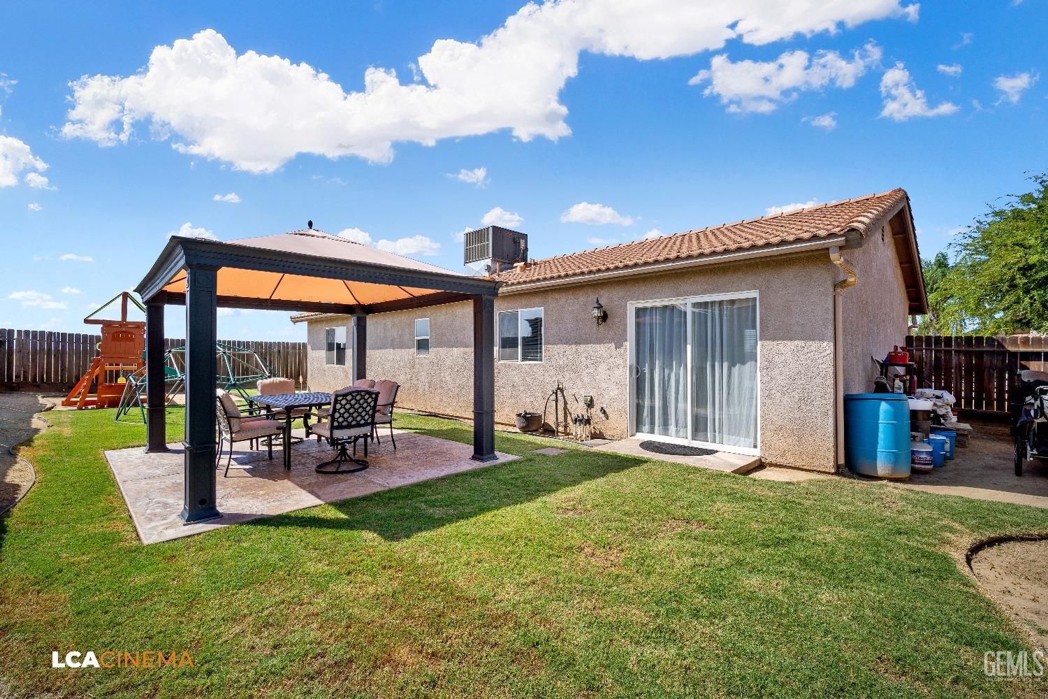 Undisclosed Address McFarland, CA 93250 - Photo 22 of 24 a view of a backyard with a patio