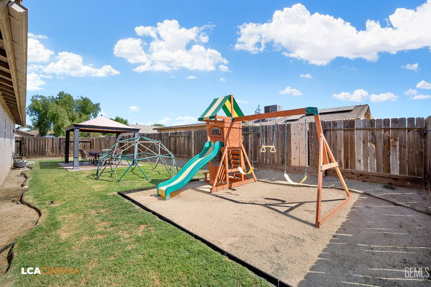 Undisclosed Address McFarland, CA 93250 - Photo 24 of 24 a view of a house with swimming pool and a yard