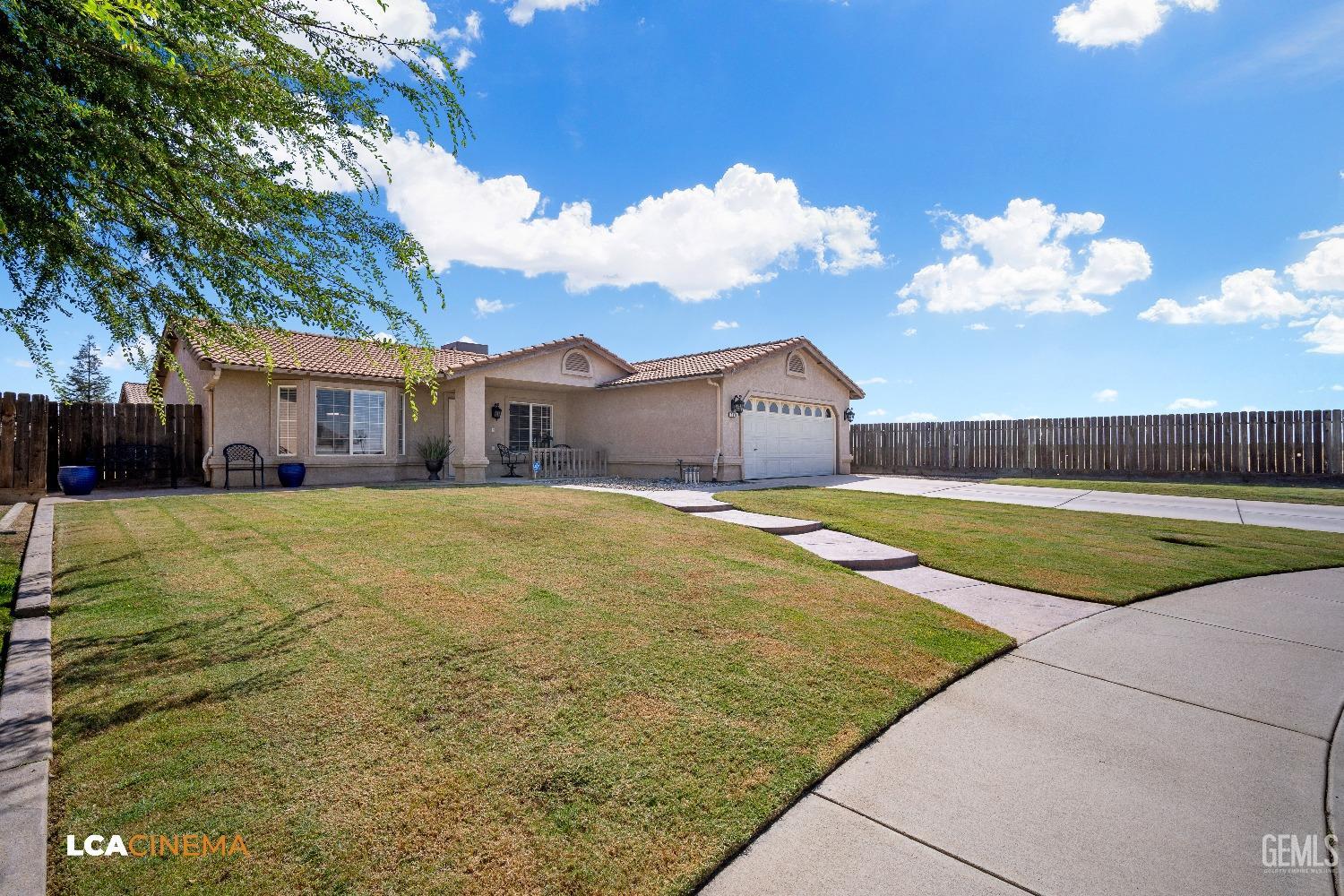 Undisclosed Address McFarland, CA 93250 - Photo 5 of 24 a house view with swimming pool in front of it