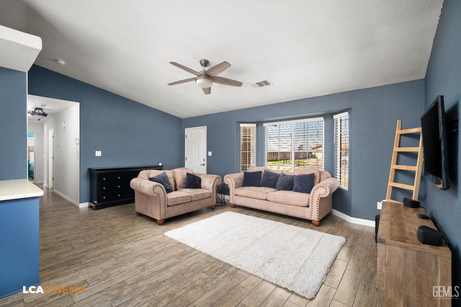Undisclosed Address McFarland, CA 93250 - Photo 9 of 24 a living room with furniture and a flat screen tv
