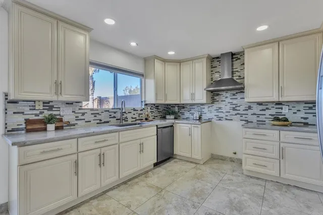 a kitchen with granite countertop cabinets and stainless steel appliances