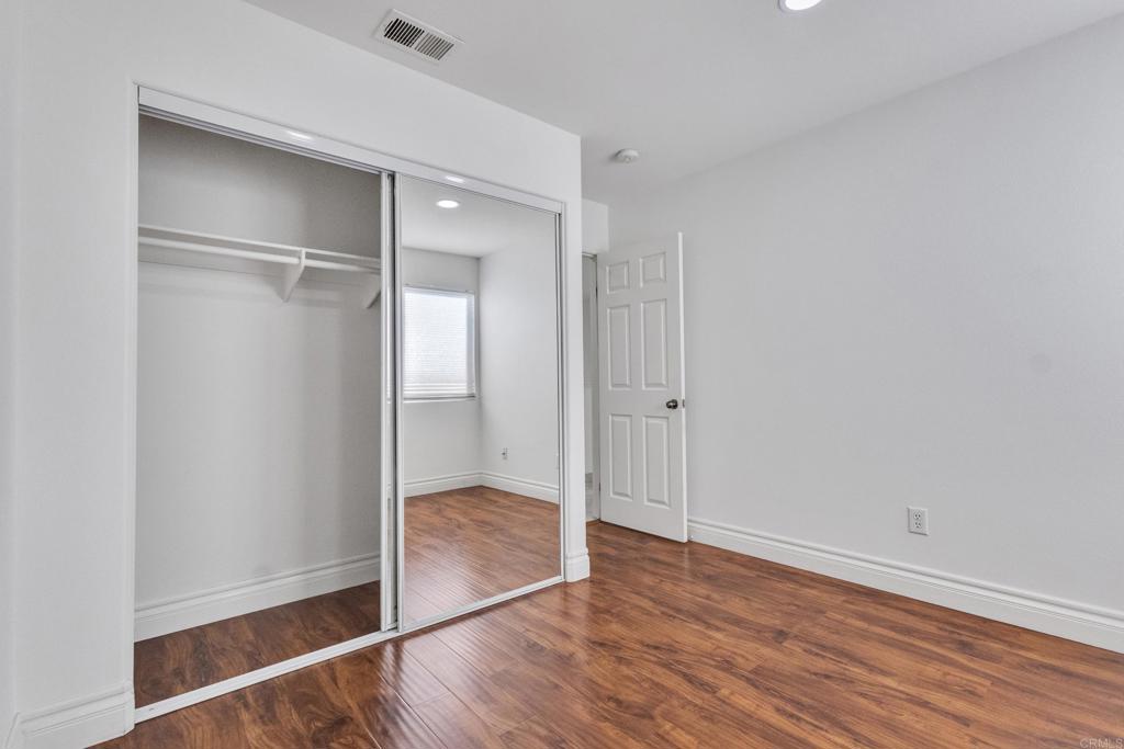 13740 Gateway View Drive El Cajon, CA 92021 - Photo 17 of 45 a view of an empty room with wooden floor
