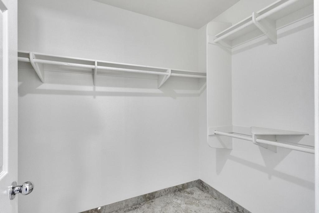 13740 Gateway View Drive El Cajon, CA 92021 - Photo 21 of 45 a view of walk in closet with empty racks