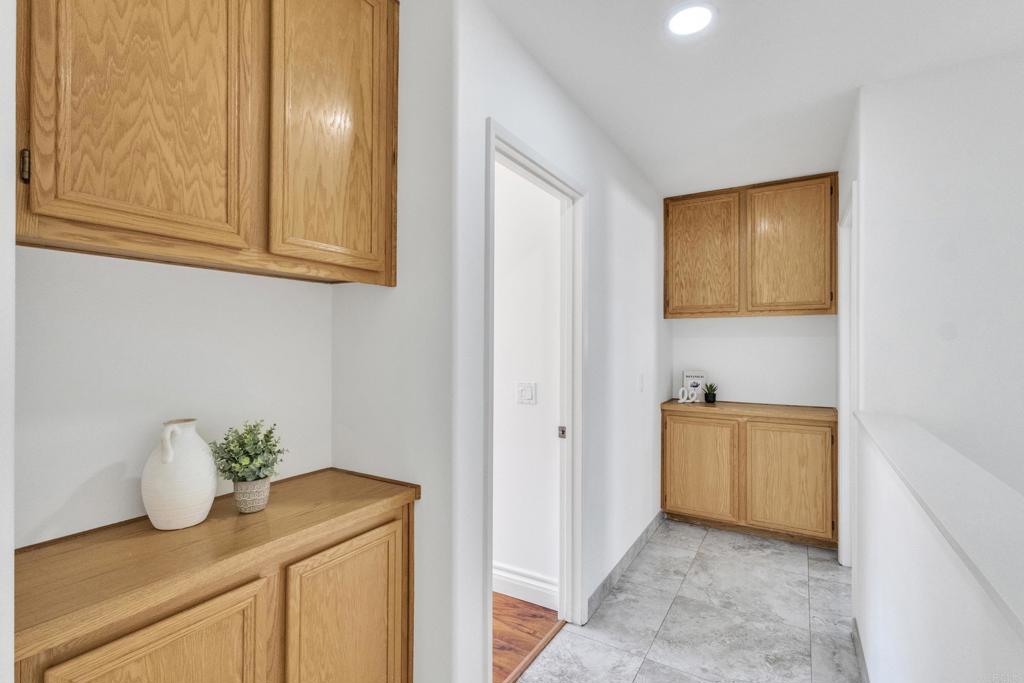 13740 Gateway View Drive El Cajon, CA 92021 - Photo 25 of 45 a bathroom with a granite countertop sink and a mirror