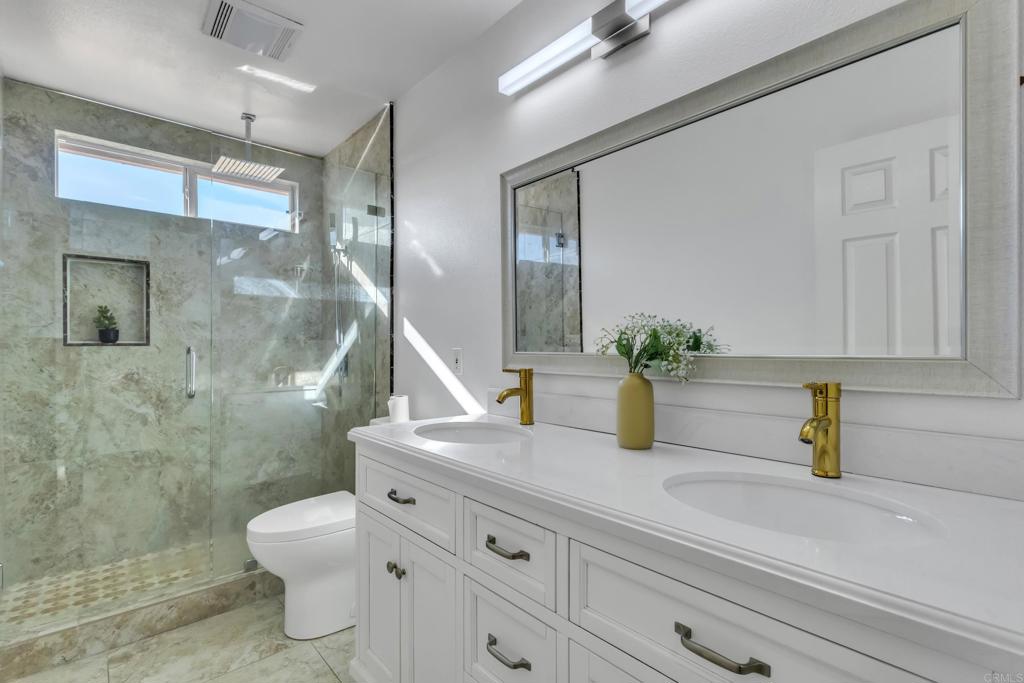 13740 Gateway View Drive El Cajon, CA 92021 - Photo 26 of 45 a bathroom with a sink a toilet and shower