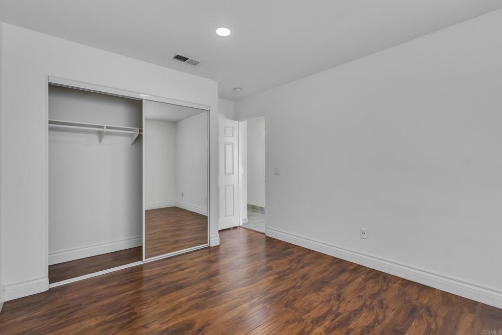 13740 Gateway View Drive El Cajon, CA 92021 - Photo 28 of 45 a view of an empty room with wooden floor and closet