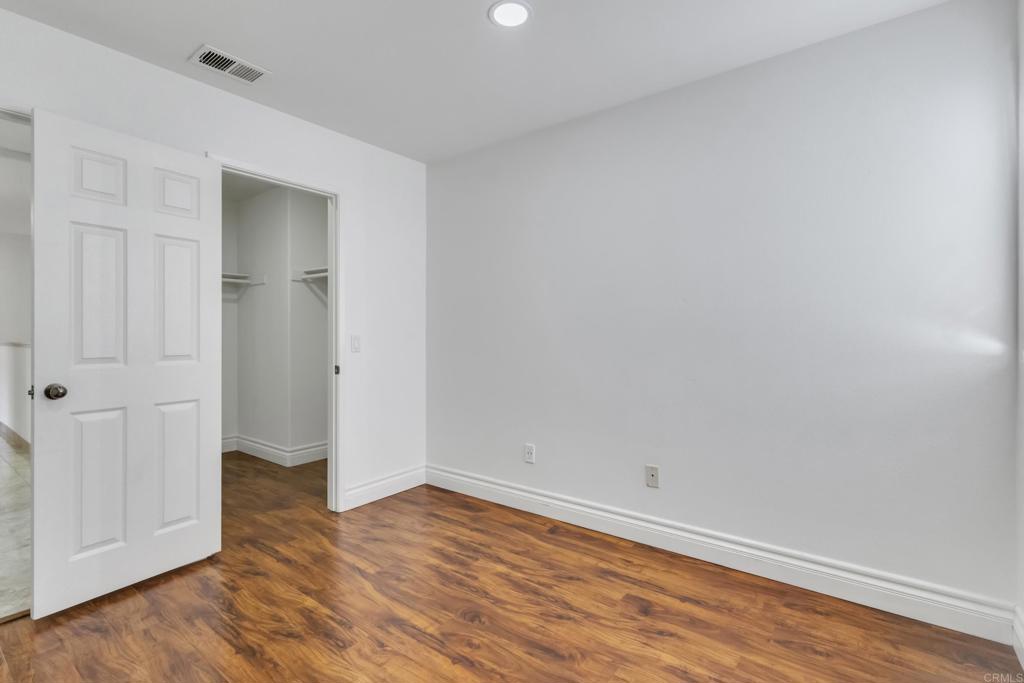 13740 Gateway View Drive El Cajon, CA 92021 - Photo 30 of 45 a view of an empty room with wooden floor