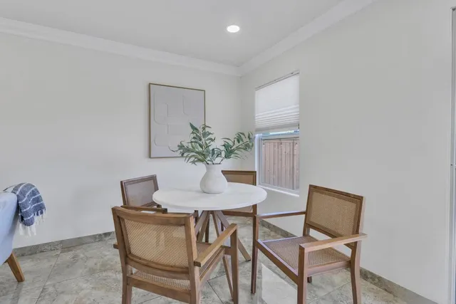 a view of kitchen with furniture and windows
