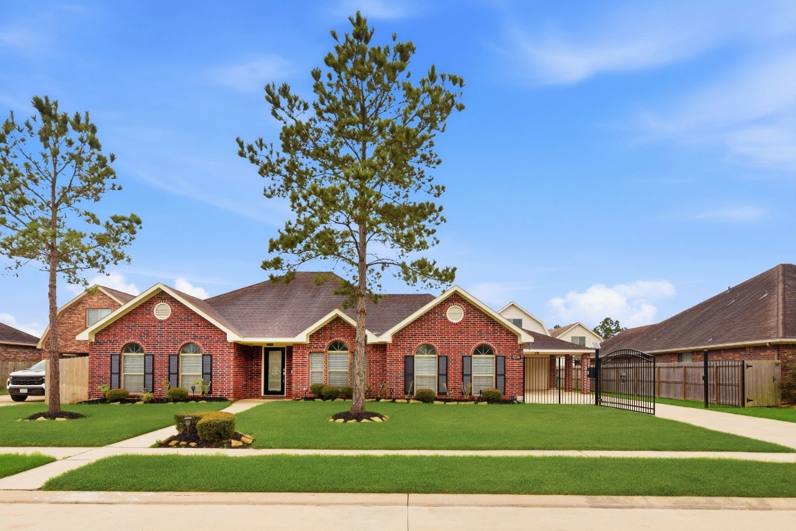6534 Granbury Road Manvel, TX 77578 - Photo 1 of 49 front view of a house with a yard