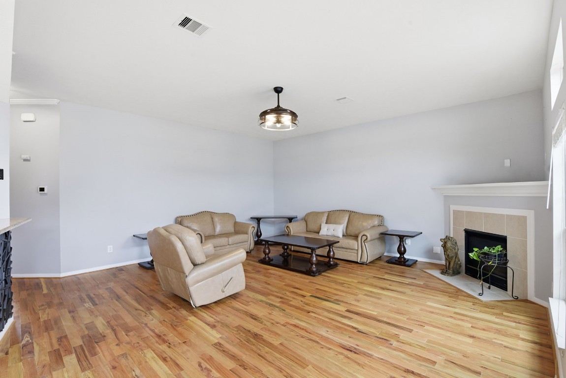 6534 Granbury Road Manvel, TX 77578 - Photo 18 of 49 a living room with furniture and a fireplace