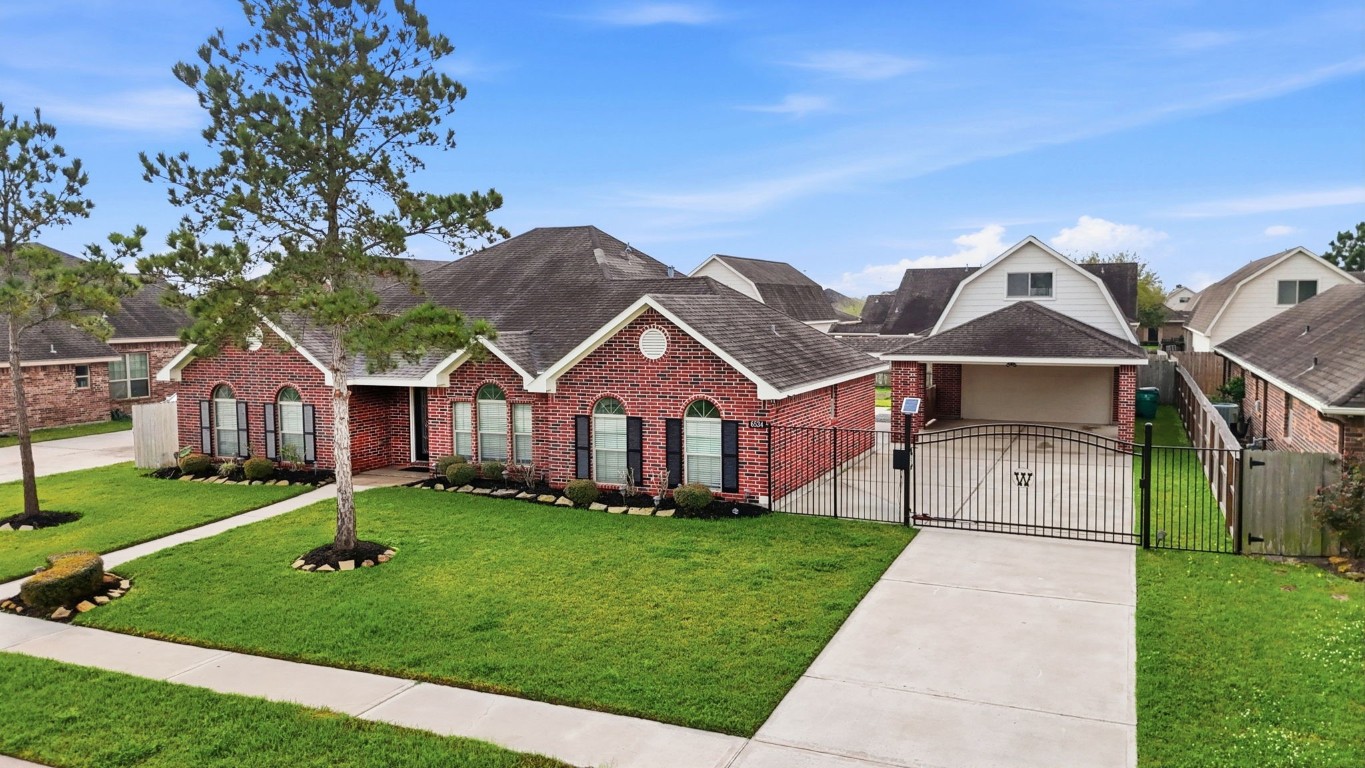 6534 Granbury Road Manvel, TX 77578 - Photo 2 of 49 front view of a house with a yard