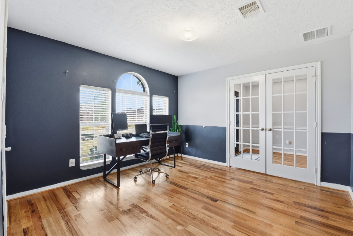 6534 Granbury Road Manvel, TX 77578 - Photo 27 of 49 a view of a livingroom with wooden floor and furniture