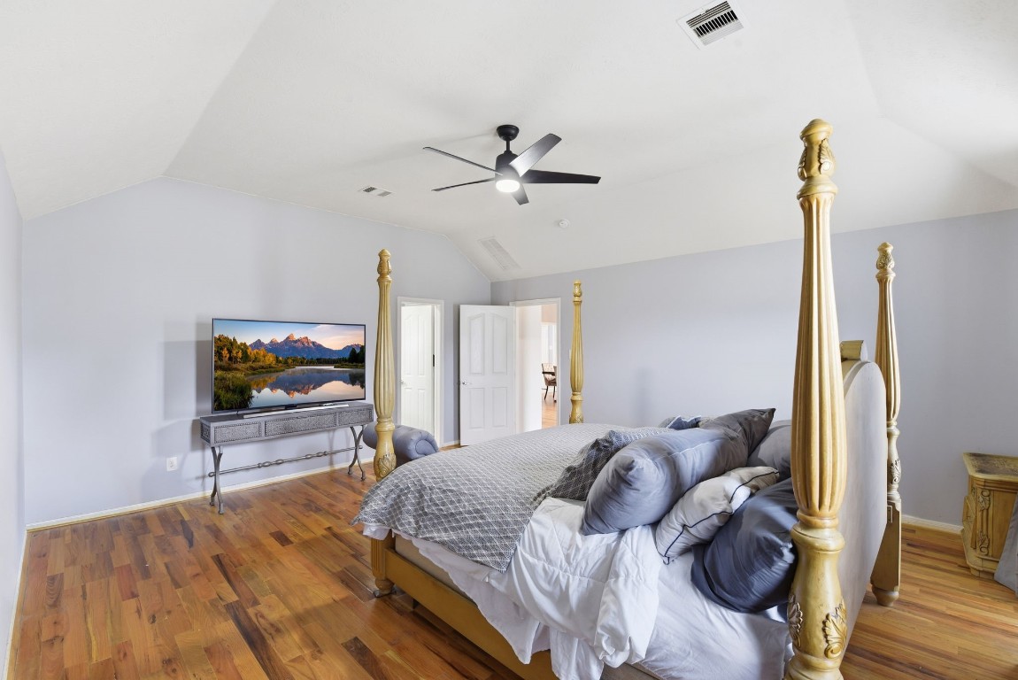 6534 Granbury Road Manvel, TX 77578 - Photo 29 of 49 a bedroom with a bed and a flat screen tv