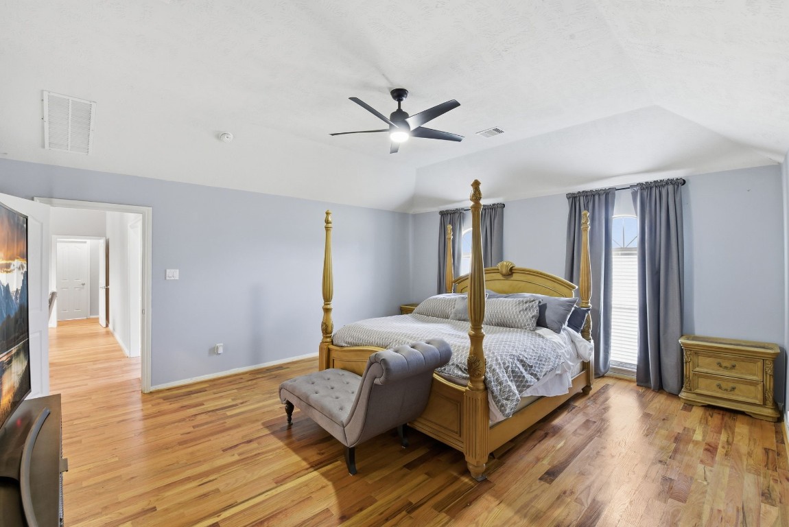 6534 Granbury Road Manvel, TX 77578 - Photo 30 of 49 a bedroom with bed and window