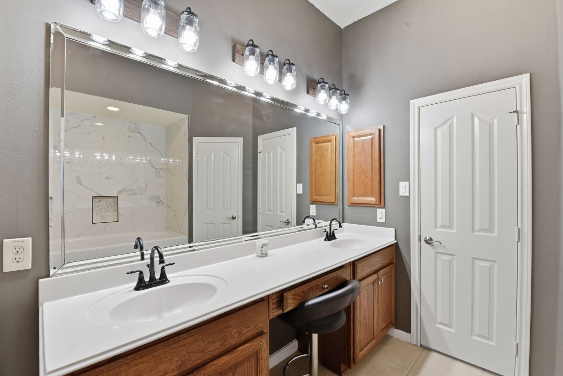 6534 Granbury Road Manvel, TX 77578 - Photo 32 of 49 a bathroom with a sink double vanity and a mirror