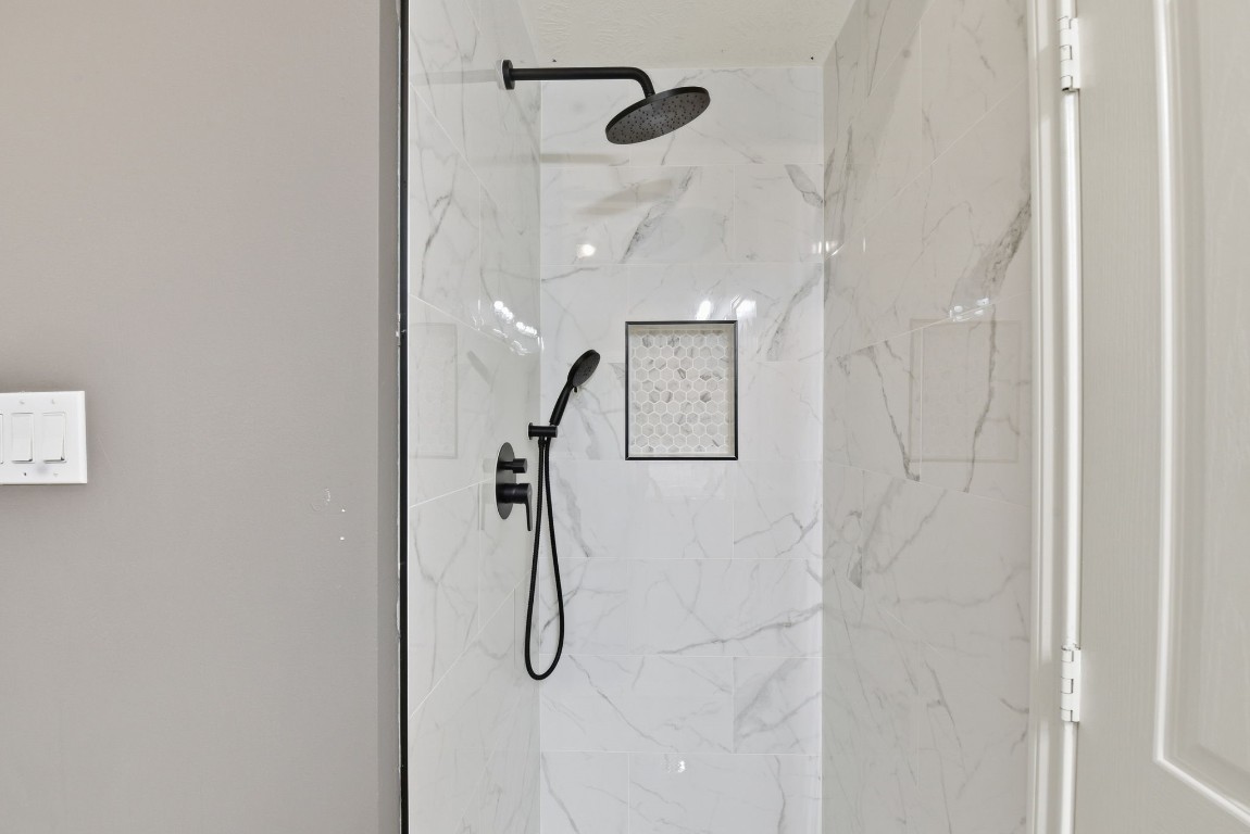 6534 Granbury Road Manvel, TX 77578 - Photo 34 of 49 a bathroom with a shower