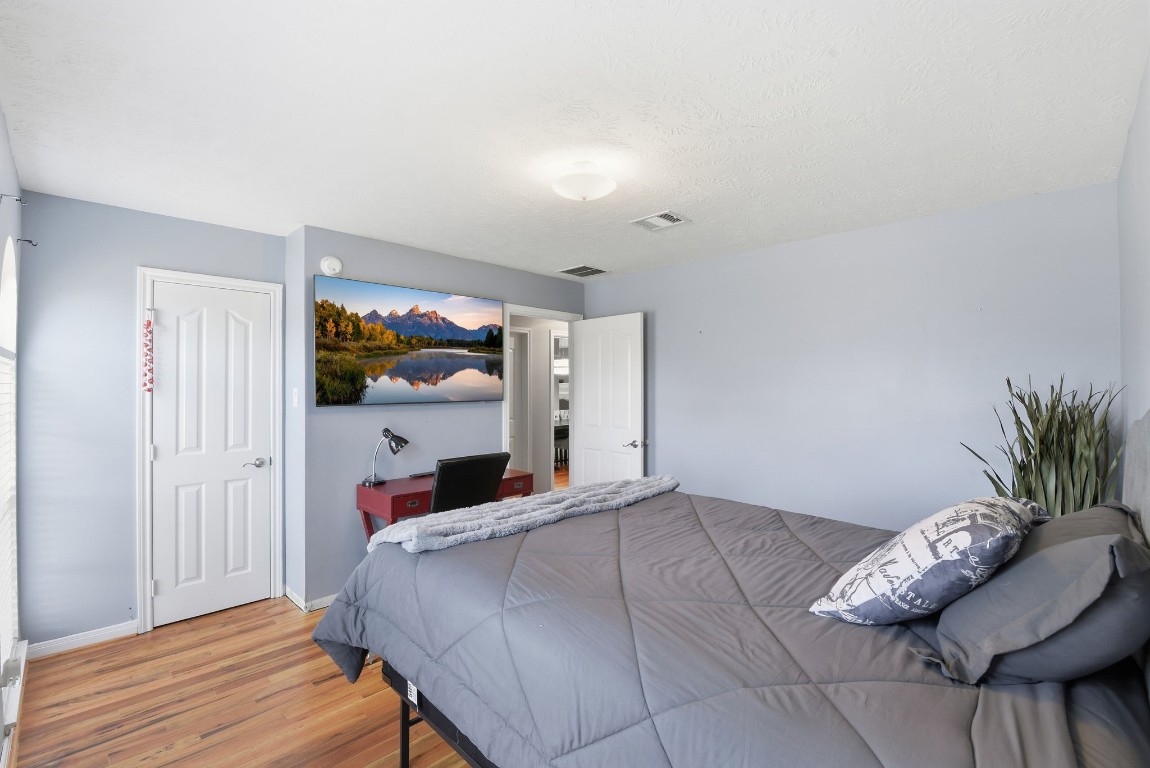 6534 Granbury Road Manvel, TX 77578 - Photo 36 of 49 a bedroom with a bed and a window