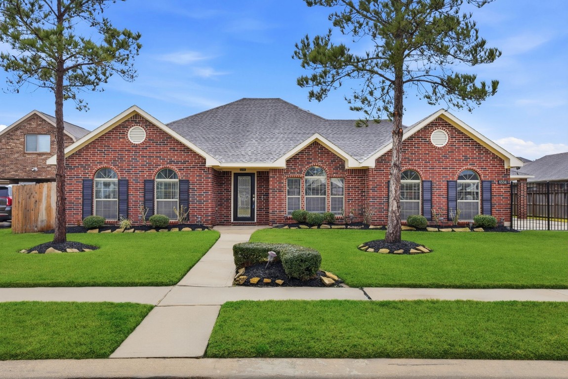 6534 Granbury Road Manvel, TX 77578 - Photo 5 of 49 a front view of a house with a yard