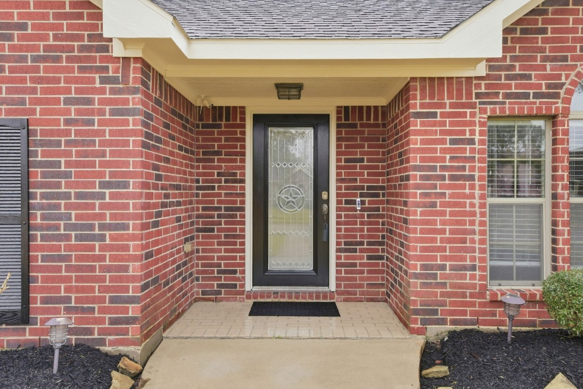 6534 Granbury Road Manvel, TX 77578 - Photo 10 of 49 a front view of a house with windows