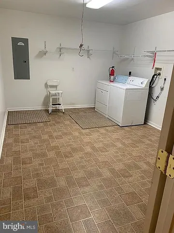 a room with a washing machine and a sink