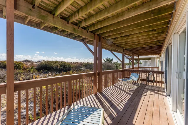 a view of balcony with wooden floor