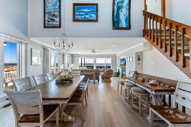 a dining room with wooden floor and breakfast area