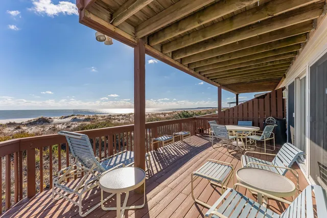 a view of a balcony with wooden floor