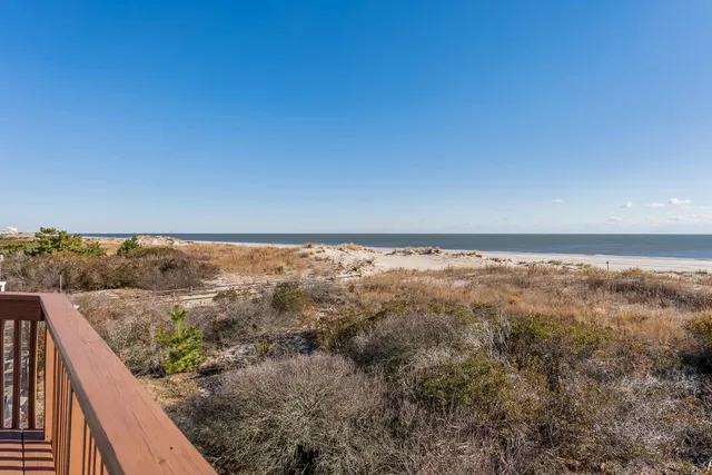 a bed room with a bed and a large window