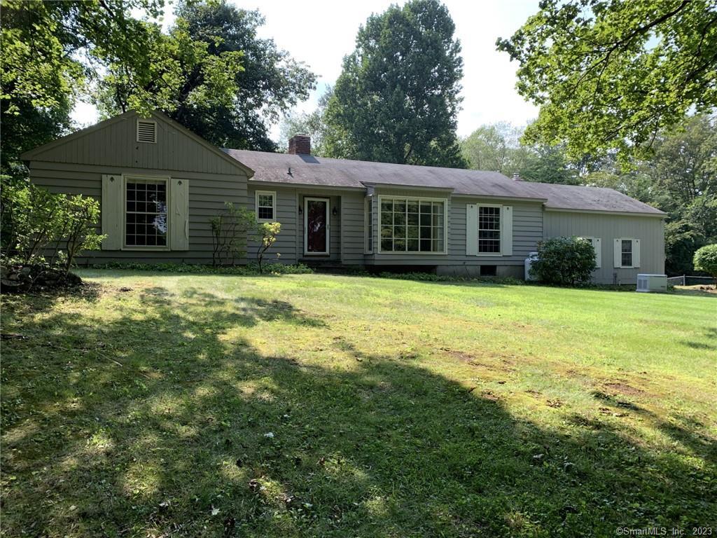 2 Cherry Lane Ridgefield, CT 06877 - Photo 1 of 1 a front view of house with yard and green space