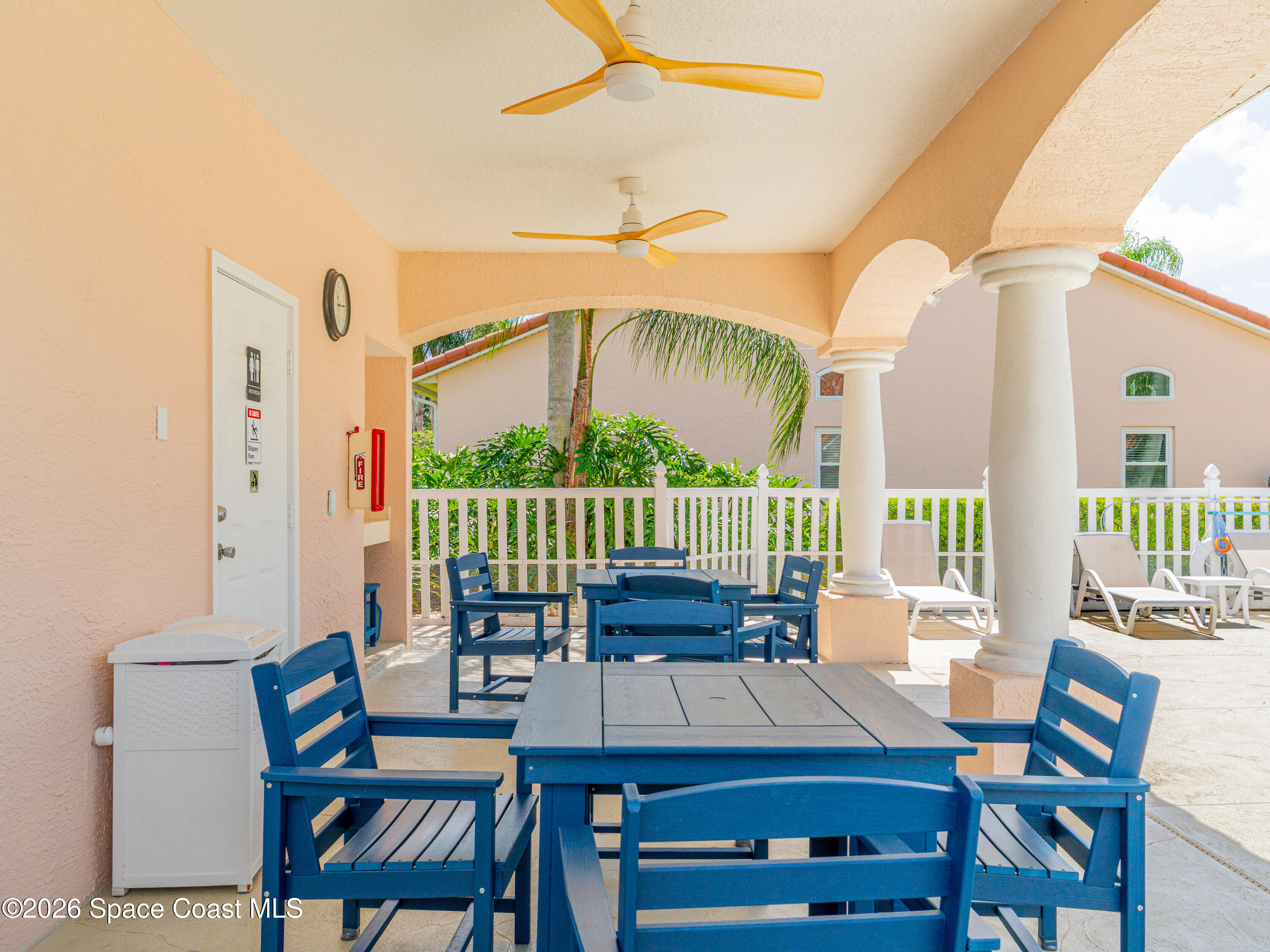 598 Renaissance Avenue Melbourne, FL 32940 - Photo 7 of 56 a view of a patio with a table and chairs