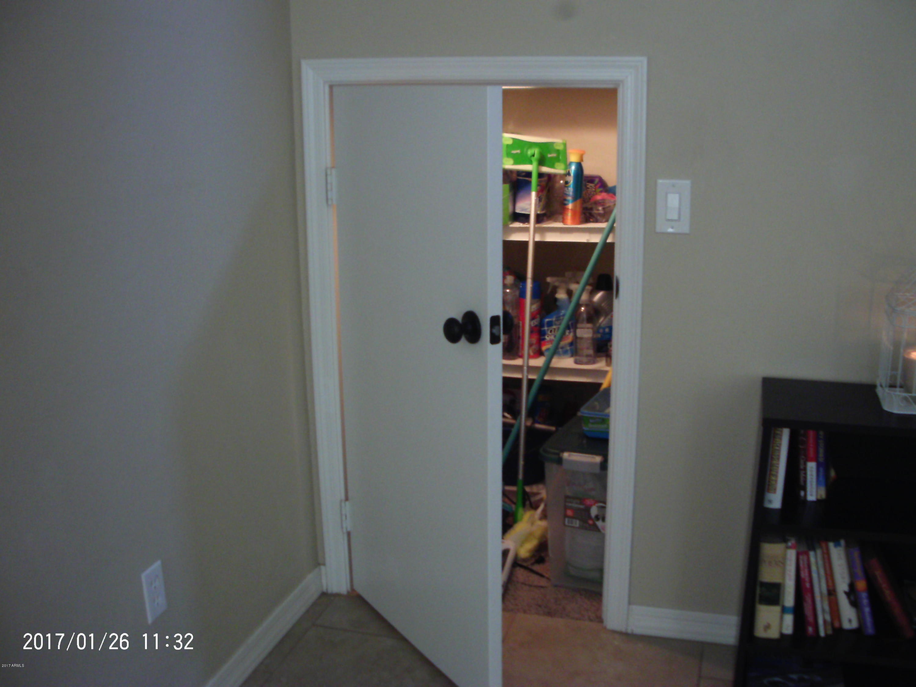 4235 East Betsy Lane Gilbert, AZ 85296 - Photo 5 of 31 Under stairs storage