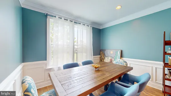 a view of a dining room with furniture and window