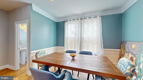 a view of a dining room with furniture window and wooden floor