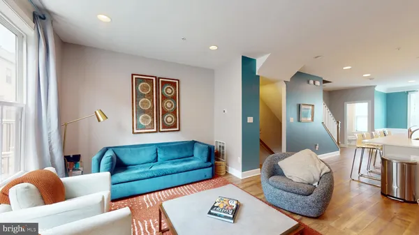 a living room with furniture or couch and a window