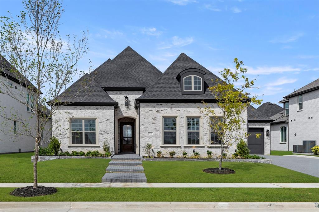 4416 Meander Way Prosper, TX 75078 - Photo 1 of 40 a front view of a house with a yard