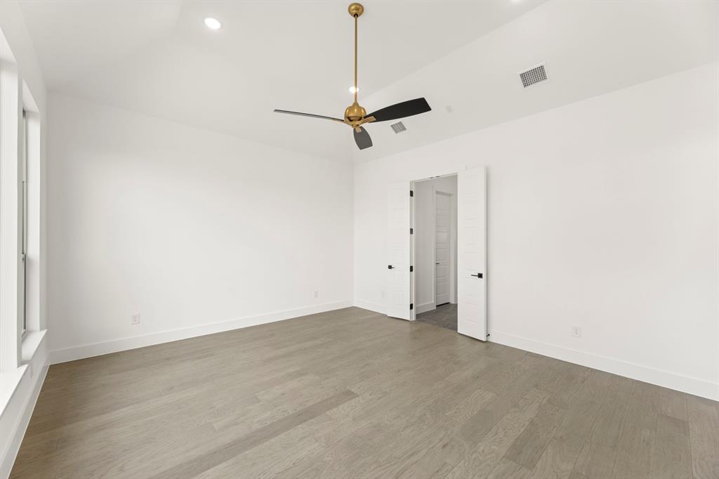 4416 Meander Way Prosper, TX 75078 - Photo 19 of 40 a view of a room with a hanging light and kitchen