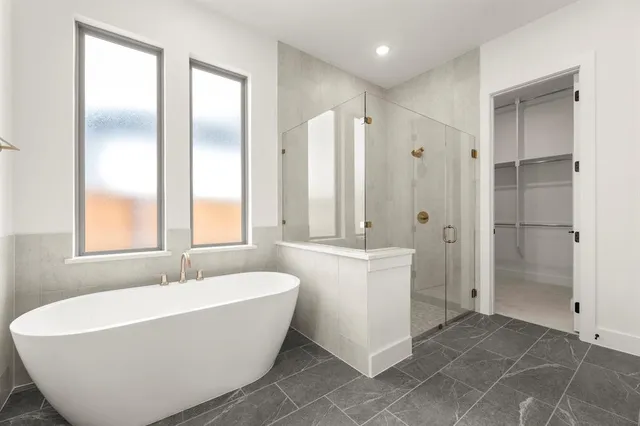 a spacious bathroom with a double vanity sink mirror and