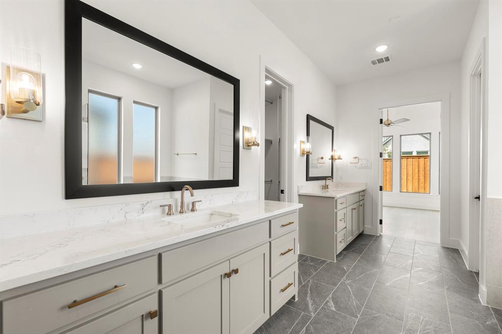 4416 Meander Way Prosper, TX 75078 - Photo 22 of 40 a spacious bathroom with a double vanity sink mirror and