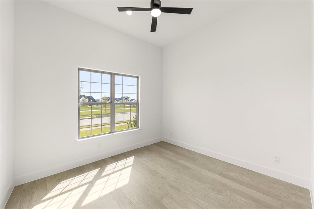 4416 Meander Way Prosper, TX 75078 - Photo 27 of 40 an empty room with a window