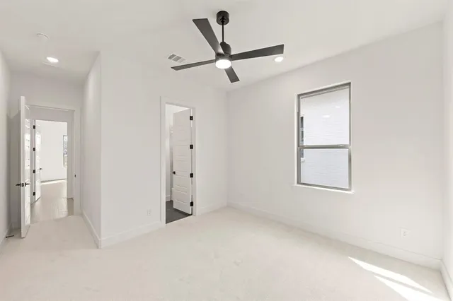 a bathroom with a sink a toilet a mirror and shower